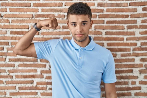 Brazilian Young Man Standing Brick Wall Strong Person Showing Arm —  Fotos de Stock