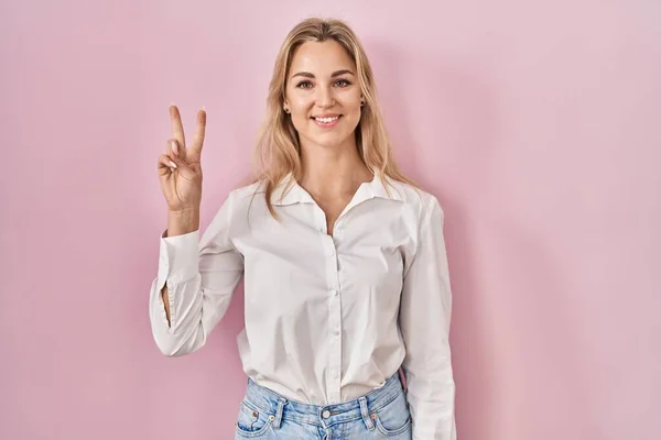 Young Caucasian Woman Wearing Casual White Shirt Pink Background Showing — Stockfoto