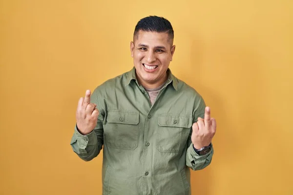 Hispanic Young Man Standing Yellow Background Showing Middle Finger Doing — ストック写真