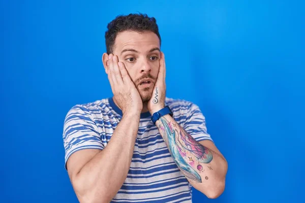Young Hispanic Man Standing Blue Background Tired Hands Covering Face — Foto de Stock