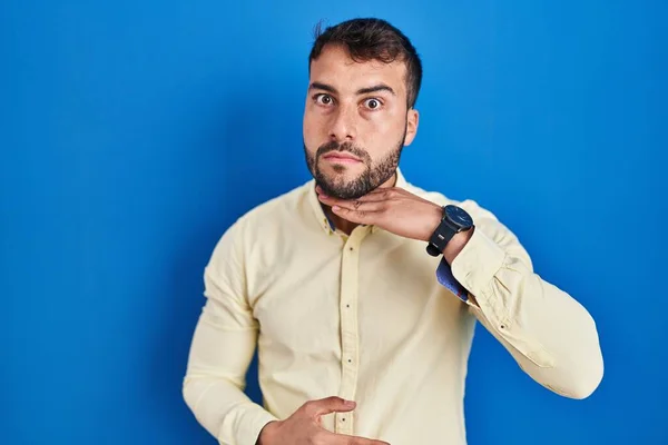 Handsome Hispanic Man Standing Blue Background Cutting Throat Hand Knife — Stockfoto