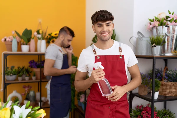 Two Hispanic Men Florists Holding Sprayer Talking Smartphone Flower Shop — Stock Photo, Image