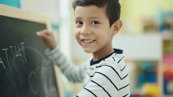 Adorable Hispanic Boy Preschool Student Writing Blackboard Kindergarten — Foto Stock