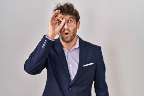 Hispanic Business Man Wearing Glasses Doing Gesture Shocked Surprised Face — Zdjęcie stockowe