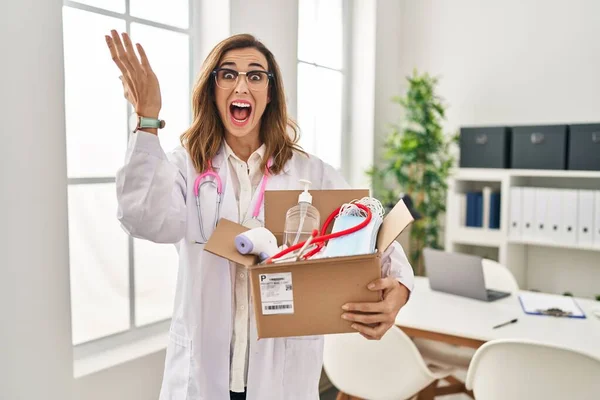 Young Doctor Woman Holding Box Medical Items Celebrating Victory Happy — Stock Photo, Image