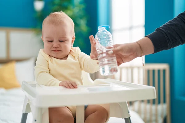 Adorable Caucasian Baby Sitting Highchair Rejecting Bottle Water Bedroom — Stock Photo, Image