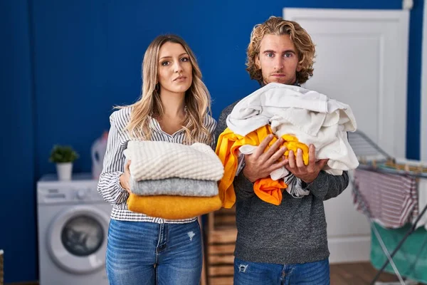 Young Couple Doing Laundry Relaxed Serious Expression Face Simple Natural — Stok fotoğraf