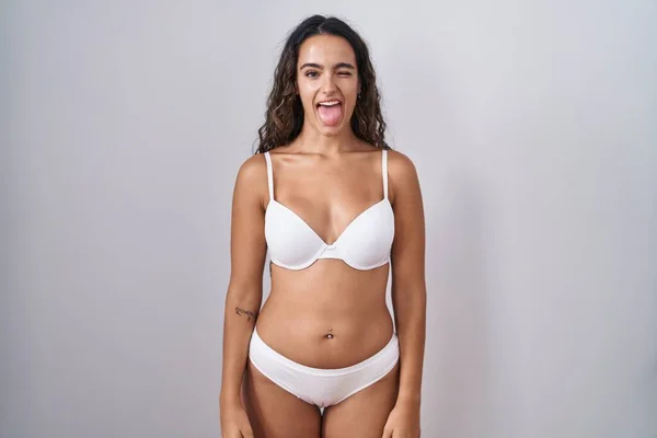 Young Hispanic Woman Wearing White Lingerie Sticking Tongue Out Happy —  Fotos de Stock