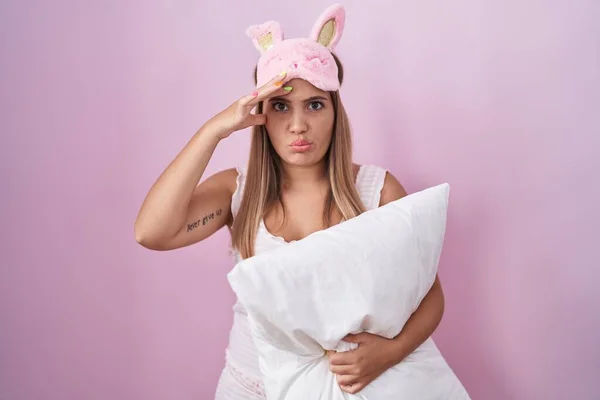 Young Blonde Woman Wearing Pyjama Hugging Pillow Worried Stressed Problem — Stockfoto