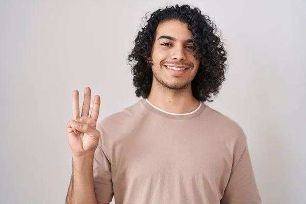 Hispanic Man Curly Hair Standing White Background Showing Pointing Fingers — Stok fotoğraf