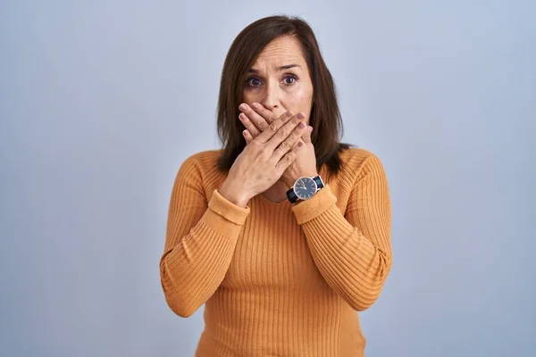 Middle Age Brunette Woman Standing Wearing Orange Sweater Shocked Covering — Stockfoto