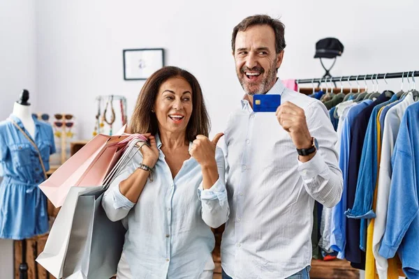 Hispanic Middle Age Couple Holding Shopping Bags Credit Card Smiling — Stockfoto