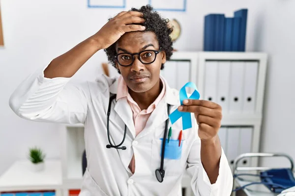 African Doctor Man Holding Blue Ribbon Stressed Frustrated Hand Head — Fotografia de Stock