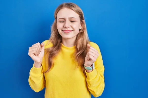 Young Caucasian Woman Standing Blue Background Excited Success Arms Raised —  Fotos de Stock