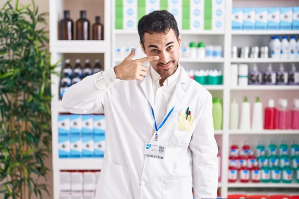 Handsome Hispanic Man Working Pharmacy Drugstore Pointing Hand Finger Face — Zdjęcie stockowe