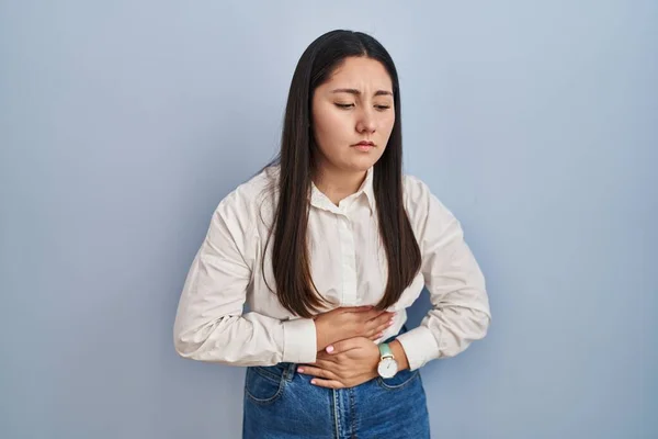 Young Latin Woman Standing Blue Background Hand Stomach Because Indigestion — ストック写真