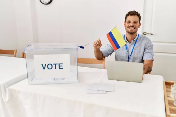 Young Hispanic Man Smiling Confident Holding Colombia Flag Working Electoral — Stock Photo, Image