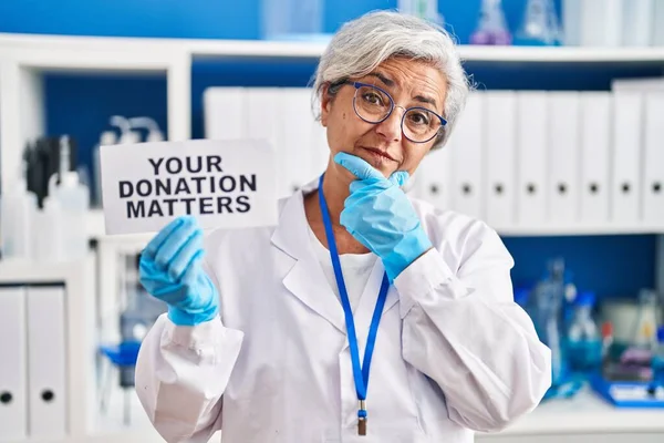 Middle Age Woman Grey Hair Working Scientist Laboratory Holding Your — Zdjęcie stockowe