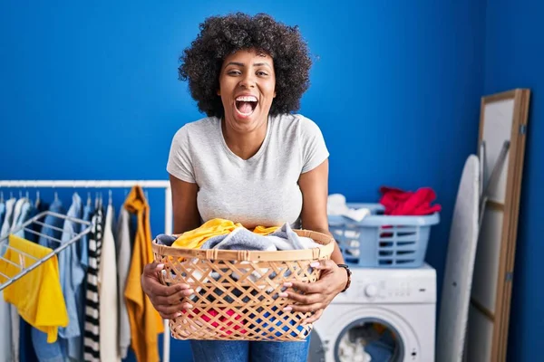 Black Woman Curly Hair Holding Laundry Basket Smiling Laughing Hard — ストック写真
