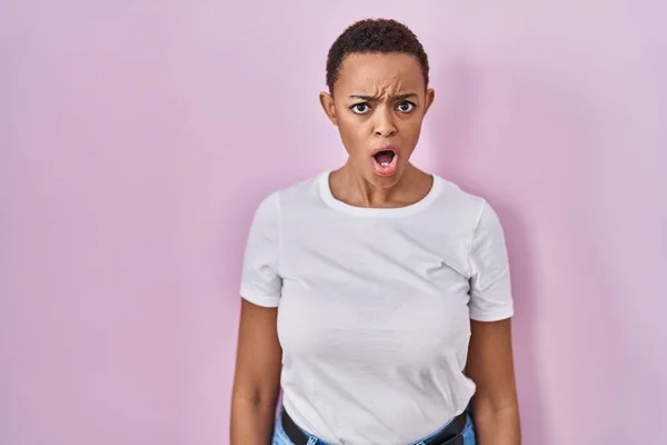 Beautiful African American Woman Standing Pink Background Shock Face Looking — Stok fotoğraf