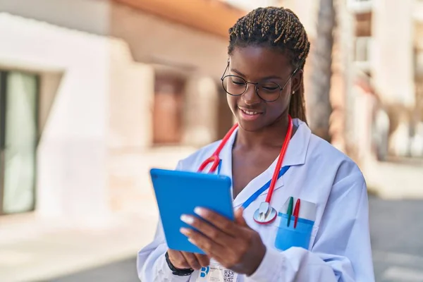 African American Woman Doctor Smiling Confident Using Touchpad Street — Stockfoto