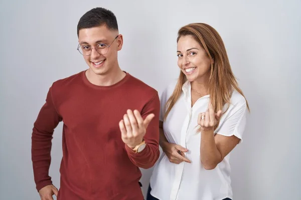 Mother Son Standing Together Isolated Background Beckoning Come Here Gesture — Stockfoto