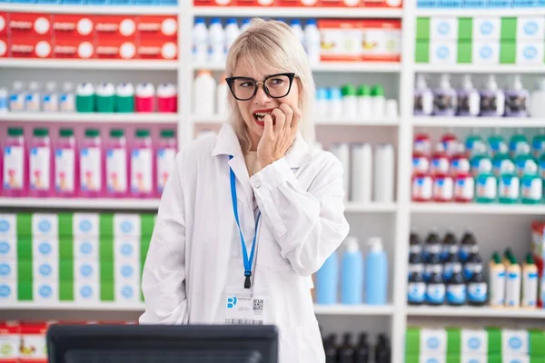 Young Caucasian Woman Working Pharmacy Drugstore Looking Stressed Nervous Hands — Stok fotoğraf