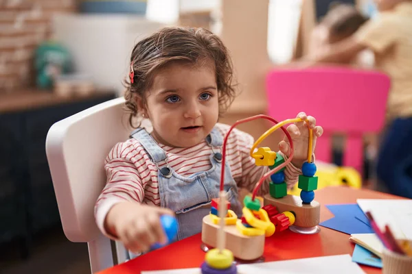 Adorable Hispanic Girl Playing Toys Sitting Table Kindergarten — Stock Fotó