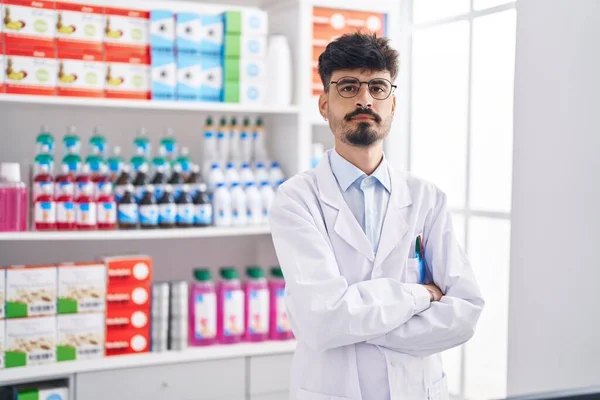 Young Hispanic Man Pharmacist Standing Arms Crossed Gesture Pharmacy — Zdjęcie stockowe