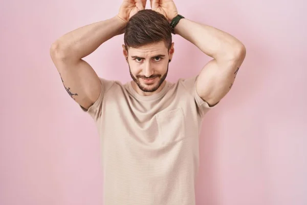Hispanic Man Beard Standing Pink Background Doing Bunny Ears Gesture — Stockfoto
