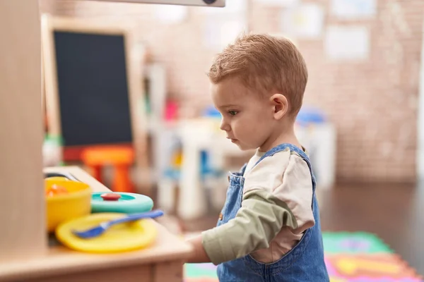 Adorable Toddler Playing Play Kitchen Standing Kindergarten — Stock Photo, Image