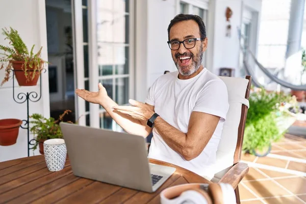 Middle Age Man Using Computer Laptop Home Pointing Aside Hands — Stock fotografie