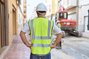 Middle age man architect standing at street