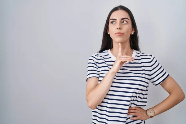 Young Brunette Woman Wearing Striped Shirt Thinking Concentrated Doubt Finger — Foto de Stock