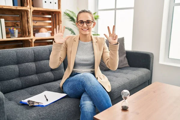 Young Woman Working Consultation Office Showing Pointing Fingers Number Eight — Stock Photo, Image