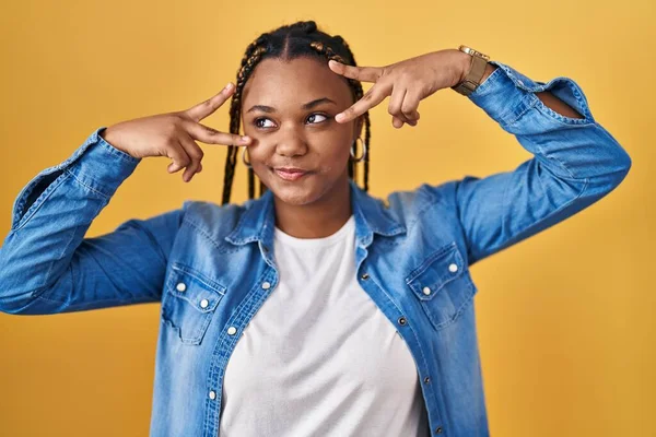 African American Woman Braids Standing Yellow Background Doing Peace Symbol —  Fotos de Stock