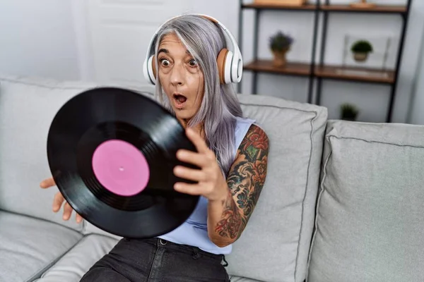 Middle Age Grey Haired Woman Listening Music Holding Vinyl Disc — Foto de Stock