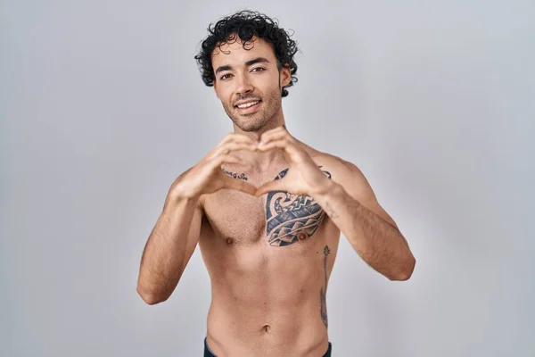 Hispanic Man Standing Shirtless Smiling Love Doing Heart Symbol Shape — Stockfoto