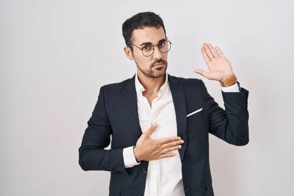Handsome Business Hispanic Man Standing White Background Swearing Hand Chest — Stockfoto