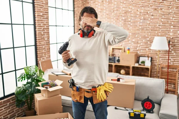 Handsome Middle Age Man Holding Screwdriver New Home Covering Eyes — Stock Photo, Image