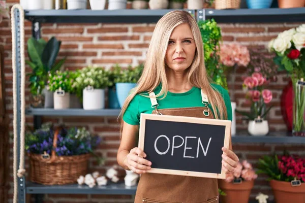 Young Woman Working Florist Holding Open Sign Skeptic Nervous Frowning — Foto Stock
