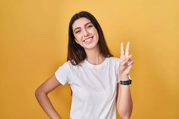 Young Beautiful Woman Standing Yellow Background Smiling Looking Camera Showing — Stockfoto