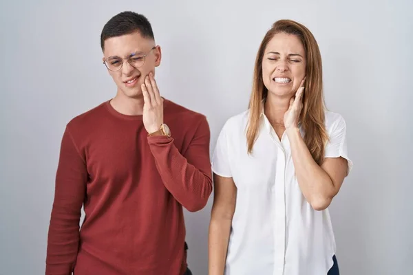 Mother Son Standing Together Isolated Background Touching Mouth Hand Painful — 图库照片