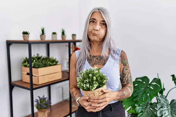 Middle Age Grey Haired Woman Holding Green Plant Pot Home — Photo