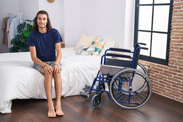 Young Hispanic Man Disabled Smiling Confident Sitting Bed Bedroom — ストック写真
