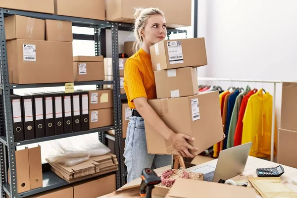 Young Blonde Woman Working Small Business Ecommerce Smiling Looking Side — Foto Stock