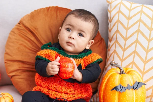Adorable Hispanic Baby Having Halloween Party Holding Pumpkin Home — Foto de Stock