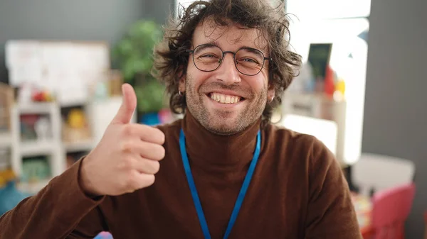 Young Hispanic Man Preschool Teacher Smiling Confident Doing Gesture Kindergarten — Fotografia de Stock