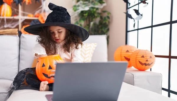 Adorable Hispanic Girl Wearing Halloween Costume Using Laptop Home — Fotografia de Stock