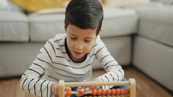Adorable Hispanic Boy Playing Abacus Sitting Floor Home — ストック写真